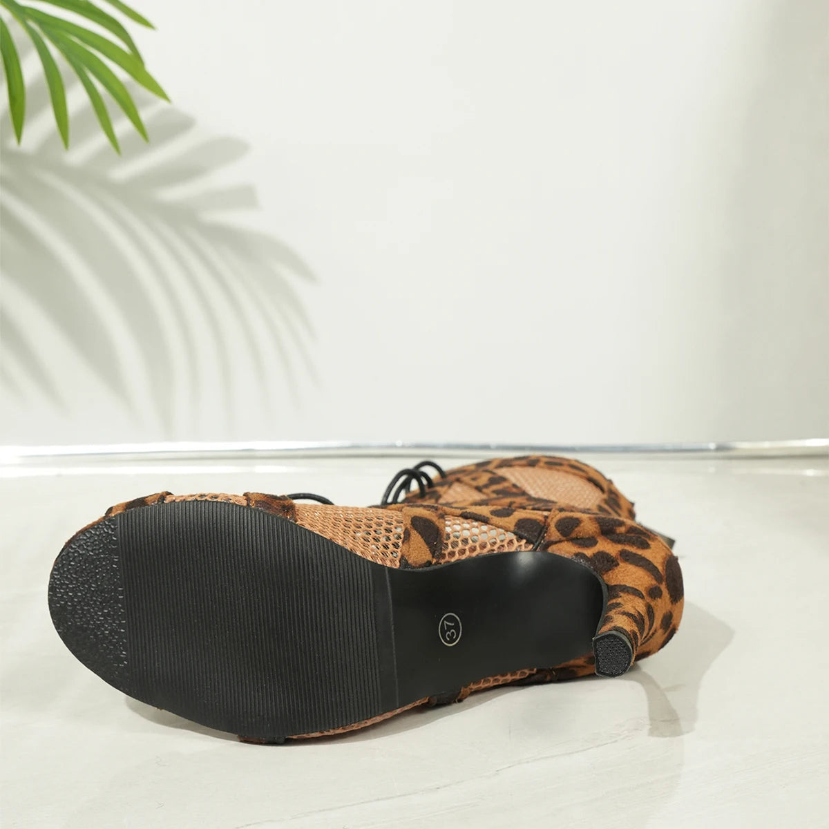 KicksStyle Seraphina — bold elegance in a single heel. With a wild print, breathable cutouts and a sensual lace-up design, this model brings striking presence, comfort and attitude to elevate any look with luxury and personality.